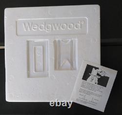 Une collection de dix assiettes de Noël en jaspe Wedgwood 1970-1978 21 cm dans leur boîte